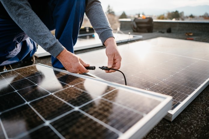Worker,Installing,Solar,Energy,Panels.,Alternative,Energy,System.,Eco,Concept